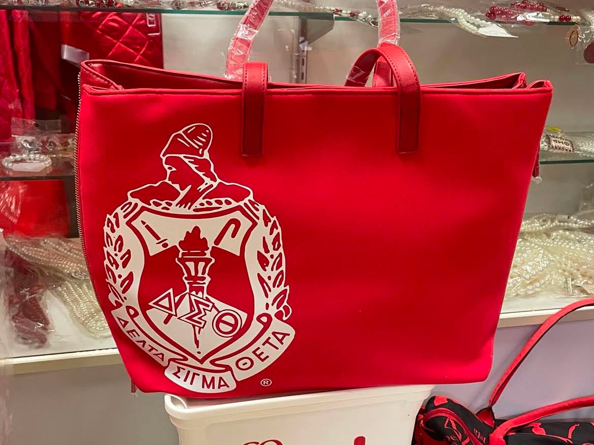 Delta Crest Signature Tote displayed front-facing with the full white crest