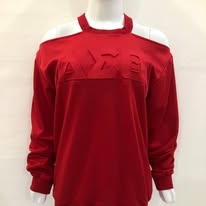 Red cold-shoulder top with embossed Delta Sigma Theta Greek letters