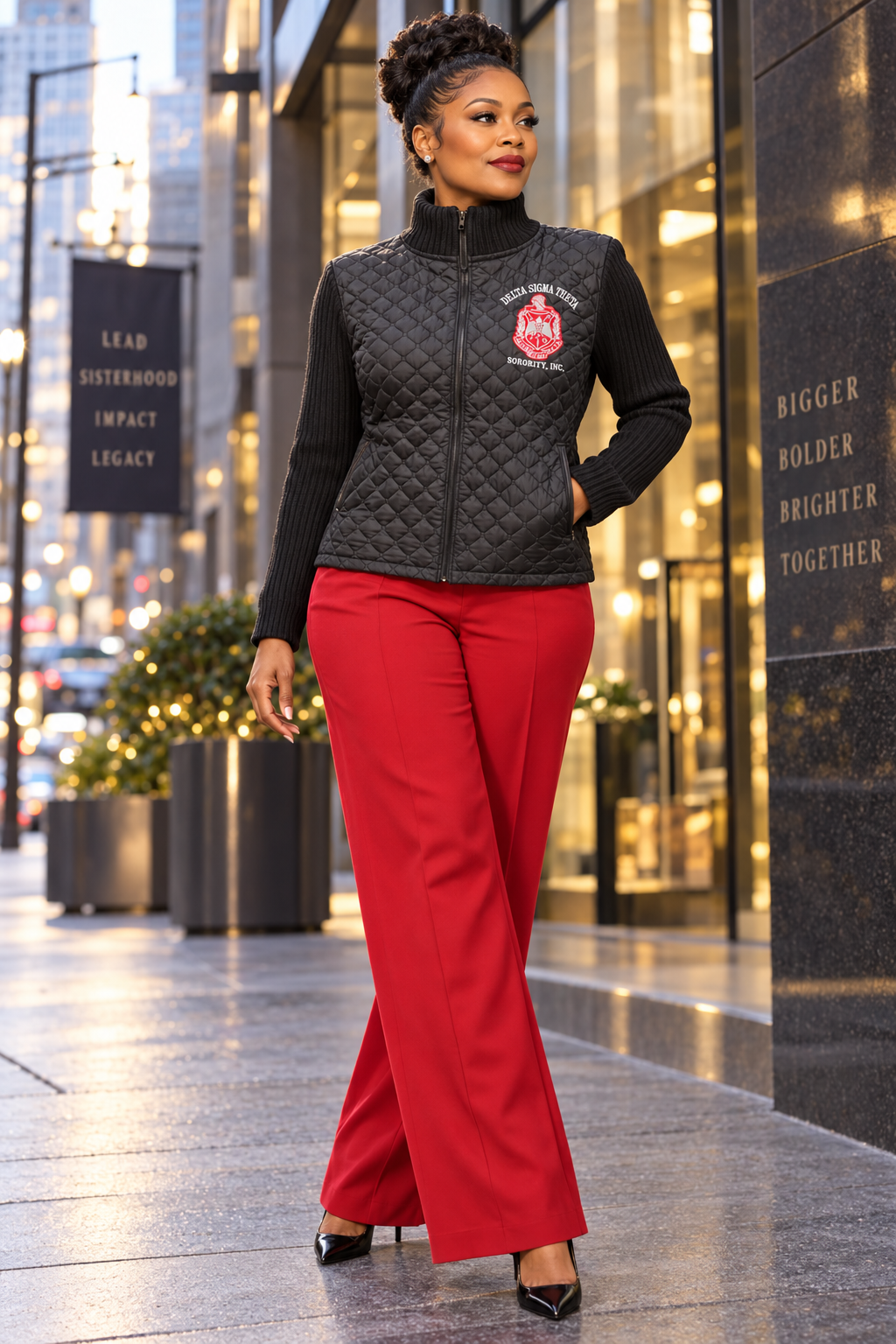 Black Quilted Crest Convertible Jacket worn as a top, styled with crimson trousers