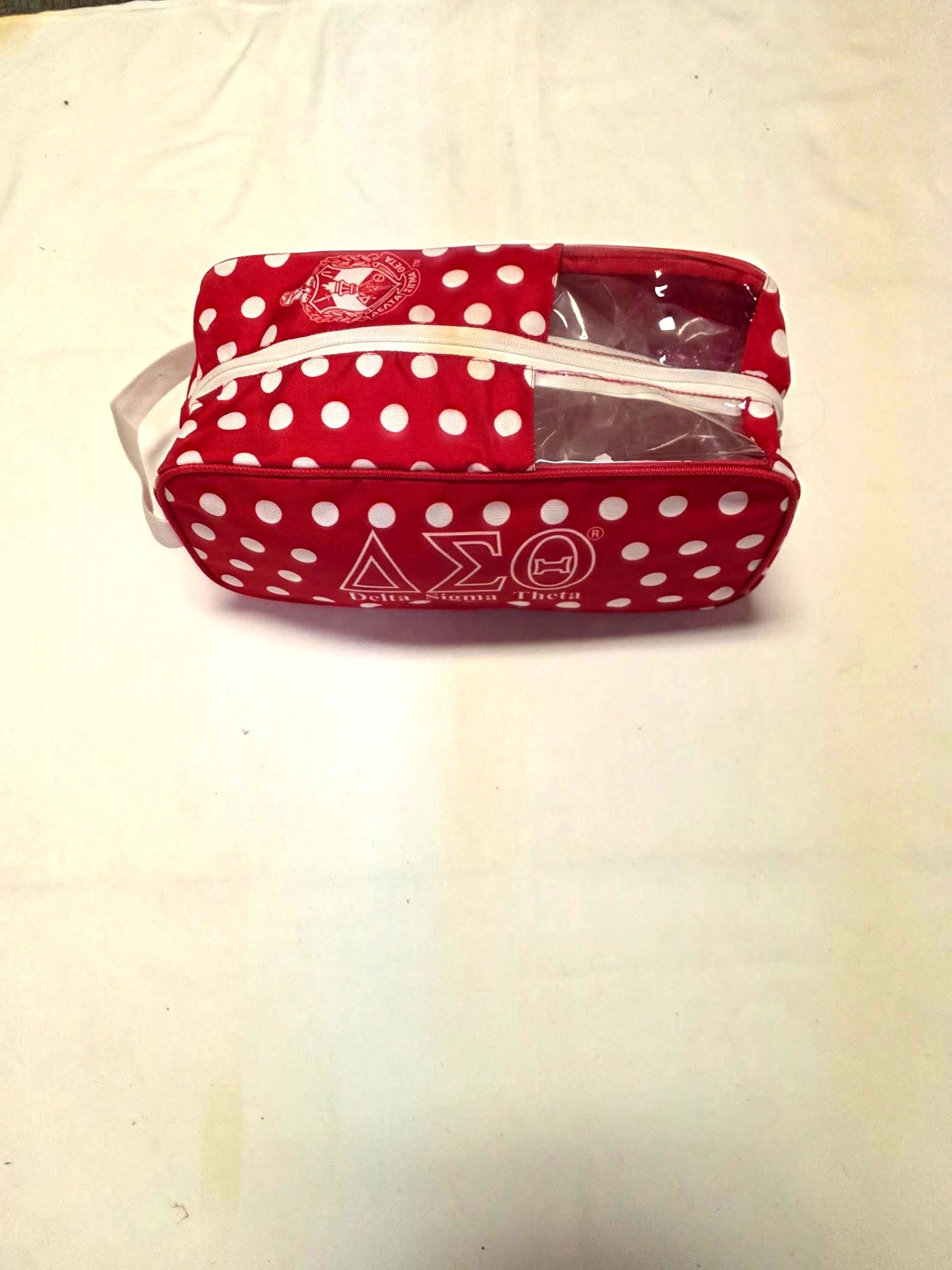Red and white polka-dot Delta Sigma Theta travel bag with a clearview window, for jewelry or shoes