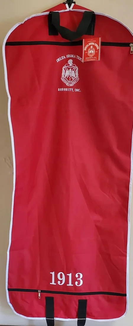 Full-length red Delta Sigma Theta garment bag with embroidered crest, Sorority Incorporated lettering and 1913 at the hem